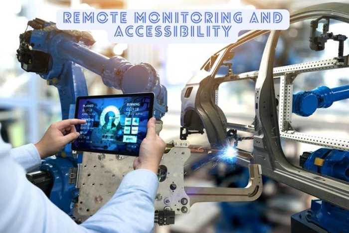 Engineer in Dindigul using a tablet to monitor and manage automated robotic arms in a car manufacturing plant, showcasing advanced industrial automation solutions available from MIT Solution.