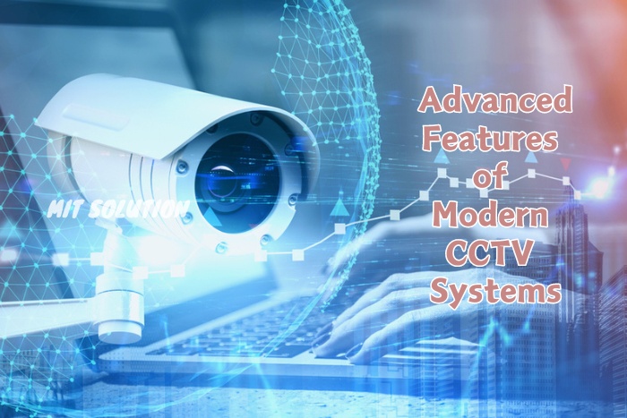 A digital representation of a high-tech CCTV camera alongside a professional working on a laptop, showcasing MIT Solution's advanced features of modern CCTV systems in Dindigul, Tamil Nadu. The caption 'Advanced Features of Modern CCTV Systems' emphasizes cutting-edge technologies like facial recognition, motion detection, and AI analytics