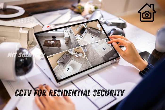 A security professional monitoring residential CCTV camera feeds on a tablet, showcasing MIT Solution's expertise in providing CCTV systems for residential security in Dindigul, Tamil Nadu. The caption 'CCTV for Residential Security' emphasizes the importance of home surveillance for enhancing safety