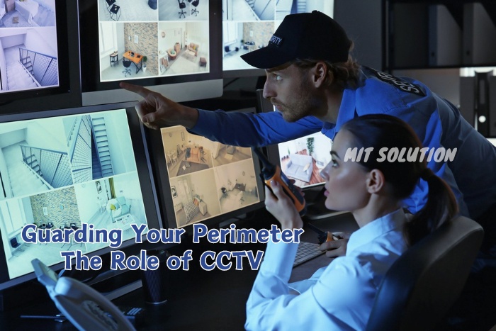 Security personnel monitoring CCTV footage on multiple screens in a control room, illustrating MIT Solution's expertise in providing perimeter security through CCTV in Dindigul, Tamil Nadu. The caption 'Guarding Your Perimeter: The Role of CCTV' emphasizes the importance of surveillance in safeguarding properties