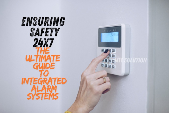 A person using a keypad to activate an integrated alarm system, showcasing MIT Solution's expertise in providing comprehensive security solutions in Dindigul, Tamil Nadu. The caption 'Ensuring Safety 24x7: The Ultimate Guide to Integrated Alarm Systems' emphasizes the reliability and round-the-clock protection offered by MIT Solution