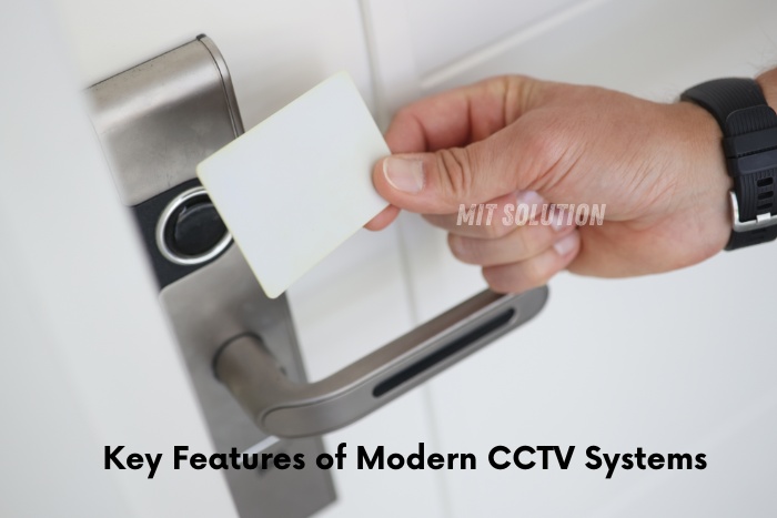 A person using a keycard to access a secured door, showcasing the key features of modern CCTV systems provided by MIT Solution in Dindigul, Tamil Nadu. The caption 'Key Features of Modern CCTV Systems' emphasizes the advanced security solutions available from MIT Solution