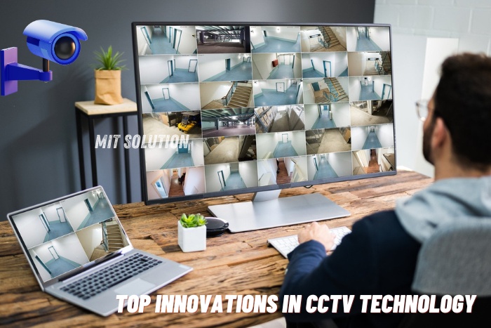 A security professional monitoring multiple CCTV feeds on a large screen and laptop, showcasing the top innovations in CCTV technology provided by MIT Solution in Dindigul, Tamil Nadu. The caption 'Top Innovations in CCTV Technology' emphasizes the advanced surveillance solutions offered by MIT Solution.