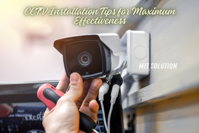 Technician installing a CCTV camera with text 'CCTV Installation Tips for Maximum Effectiveness' by MIT Solution. Serving Dindigul, Tamil Nadu, we specialize in CCTV, access control devices, and alarm systems, ensuring top security solutions for your needs.